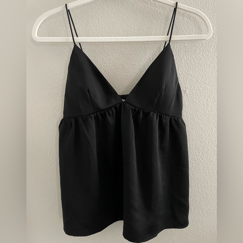 Black spaghetti strap blouse. Labeled as S but can fit a M as well.